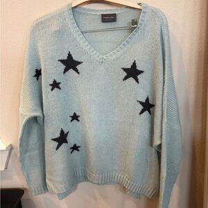 Wooden Ships Light Blue V-Neck Sweater with Black Stars